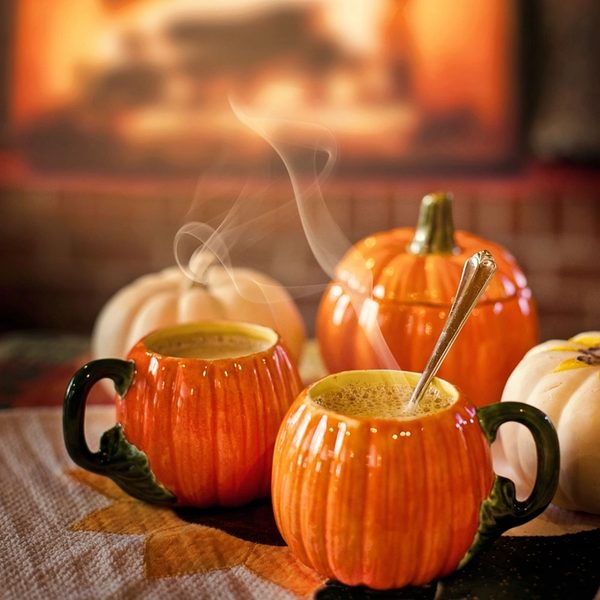 Pumpkin mugs with a warm drink