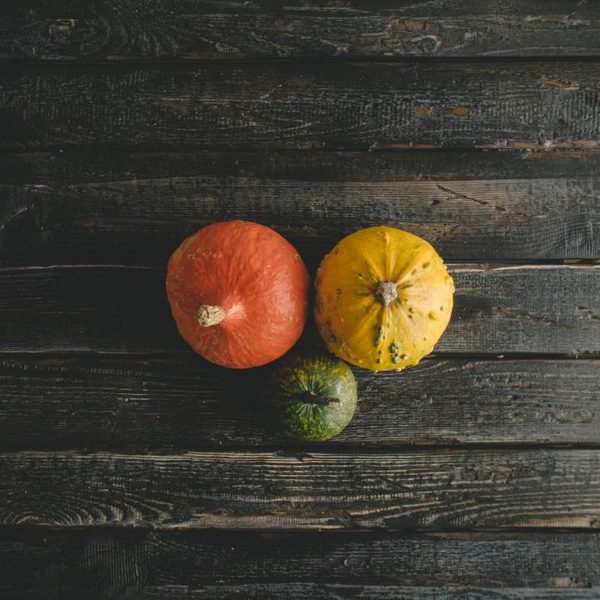 Small pumpkins on a wooden table